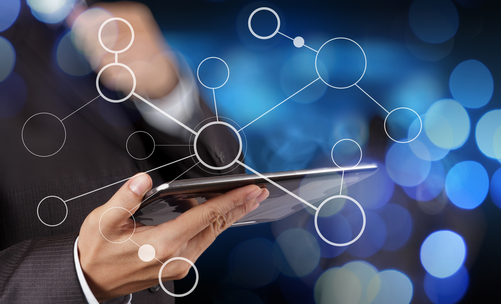 Hand of a businessman showing a blank flowchart on a new, modern computer as a concept with bokeh exposure.